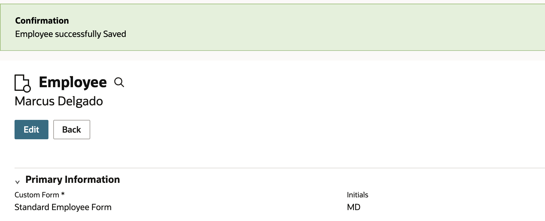 Marcus Delgado's employee record after saving, with a Confirmation banner reading Employee successfully Saved.
